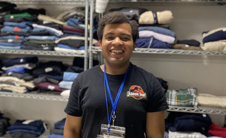 Volunteer working the clothes bank